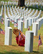Child Praying in Cemetery