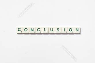 Conclusion formed of scrabble blocks on white background.