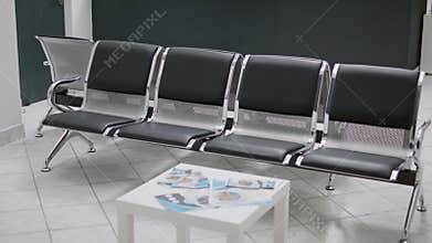 Empty hospital reception waiting room to attend medical checkup visit