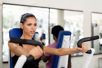 People training and working out in fitness club