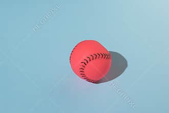 A toy for dogs in the shape of a baseball on a blue background