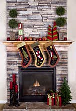 Christmas stockings hanging from fireplace