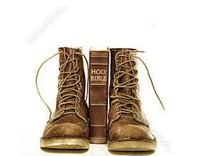 Holy bible and rugged boots