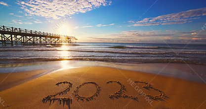 Sunrise over the sea and beach, happy new year 2023 concept