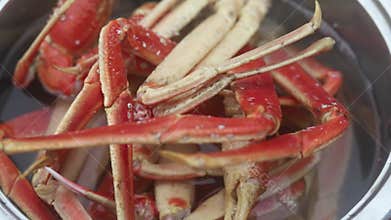 Legs of fresh red Kamchatka crab or king crab in a pot of water