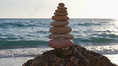 Concept of balance and harmony - stone stacks on the beach