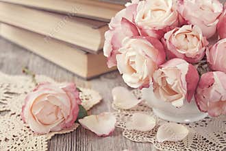 Pink roses and old books