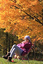 Smiling little girl surrounded by fall colors