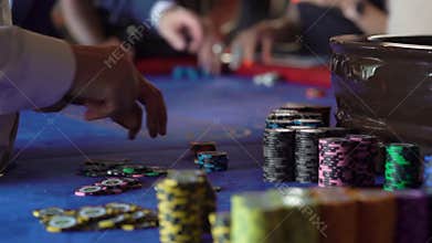Game chips on a table in casino. Croupier or dealer, cash and betting.