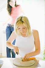 Girl cutting carrot