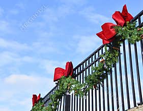 Pine Bough and Red Bows on Wrought Iron Fence 2