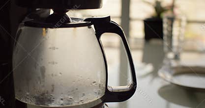 Preparing delicious invigorating filter coffee in the kitchen at home