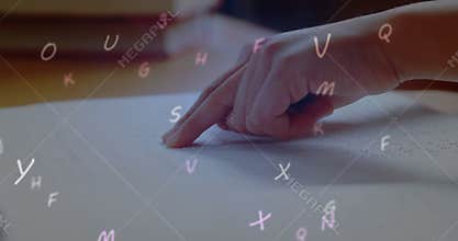 Animation of letters and numbers over caucasian schoolchild reading braille