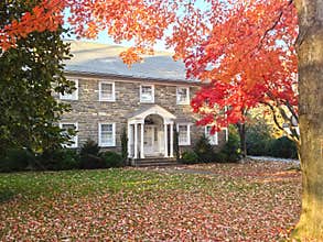 Autumn foliage at family house frontyard
