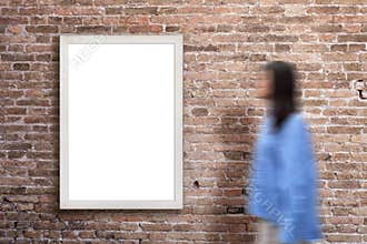 Vertical billboard on a brick wall, showcasing a blank surface for design promotion