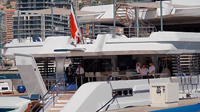 Monaco, Monte-Carlo, 29 September 2022: Invited wealthy clients inspect megayachts at the largest fair exhibition in the