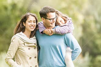 Happy family of three having fun outdoor.