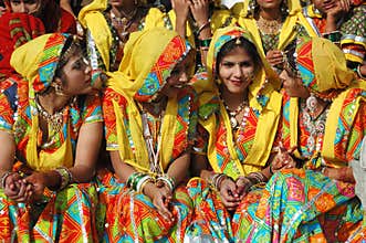 Beautiful indian women in traditional rajasthani clothes at Pishkar camel fair
