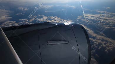 Breathtaking view from plane's illuminator during morning flight. 4K video