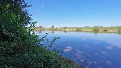 View of the Danube, a river that flows through Bavaria with fields and meadows on the banks