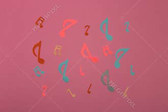 colorful music notes on a pink background, creative music design