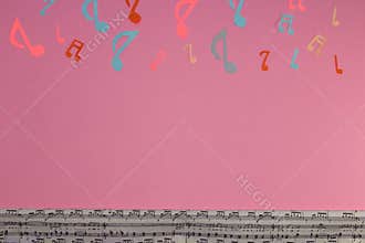 pink background as copy space with top and bottom background music notes, creative music design