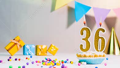 Happy birthday card from candles with the number 36, golden numbers from candles for congratulations on any holiday with beautifu