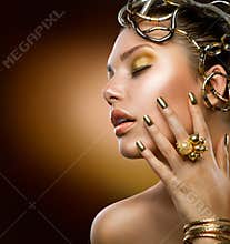 Fashion Girl Portrait. Gold Makeup