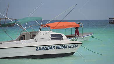 Boats in the ocean near the coast of Zanzibar, Tanzania