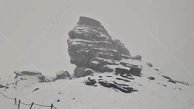 Handheld footage with the Sphinx Sfinxul, a natural rock formation in the Bucegi Natural Park, in the Bucegi Mountains