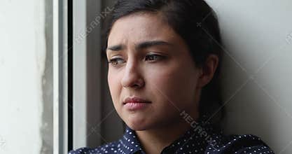 Young Indian woman overcomes personal failure looking unhappy