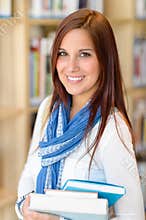 Female student carry education books from library