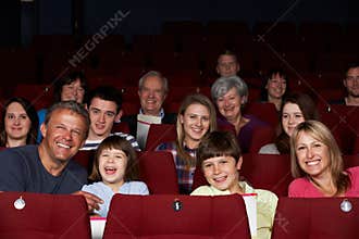 Family Watching Film In Cinema