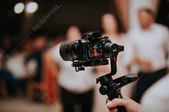 Cameraman shooting a wedding with a video camera
