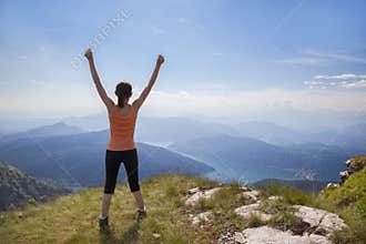 Happy woman on mountain top