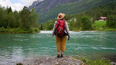 Girl tourist walk Beautiful Nature Norway natural landscape. lovatnet lake.