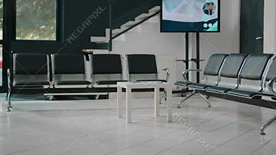 Empty hospital reception space with waiting room chairs