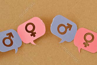 Broken chain of pink and blue speech bubbles with female and male gender symbol - Concept of communication differences between men