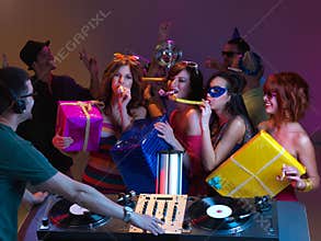 Blowing paty horns at the dj