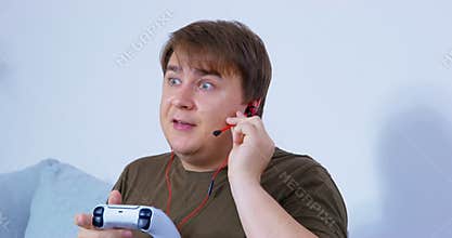 Man leaves controller and earphones to help with chore