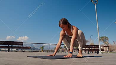 Caucasian beautiful woman doing yoga in the park. Be H3althy