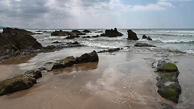 Sand rocks and seaweed on Northcott beach