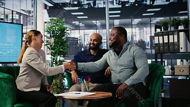 Business people signing a legal certified form to ensure their partnership