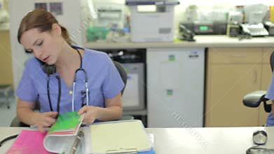 Medical Staff Working At Nurses Station