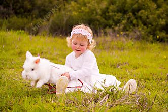 Small girl with pet rabbit