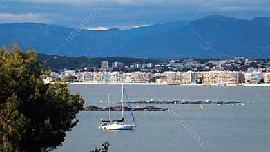 White boat docked on the sea with the bu