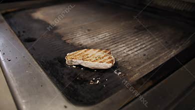 Chef Flipping The Swordfish Slice For Grilling