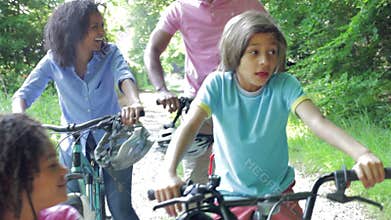 African American Family On Cycle Ride In Countryside