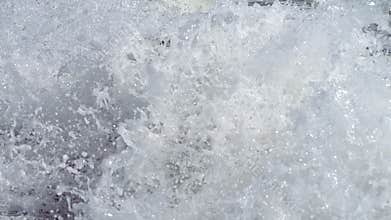 Boy dive into a foaming wave. Live a healthy life. Be H3althy