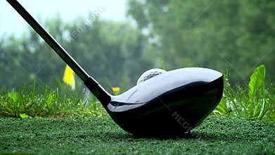 Golfer shooting a golf ball